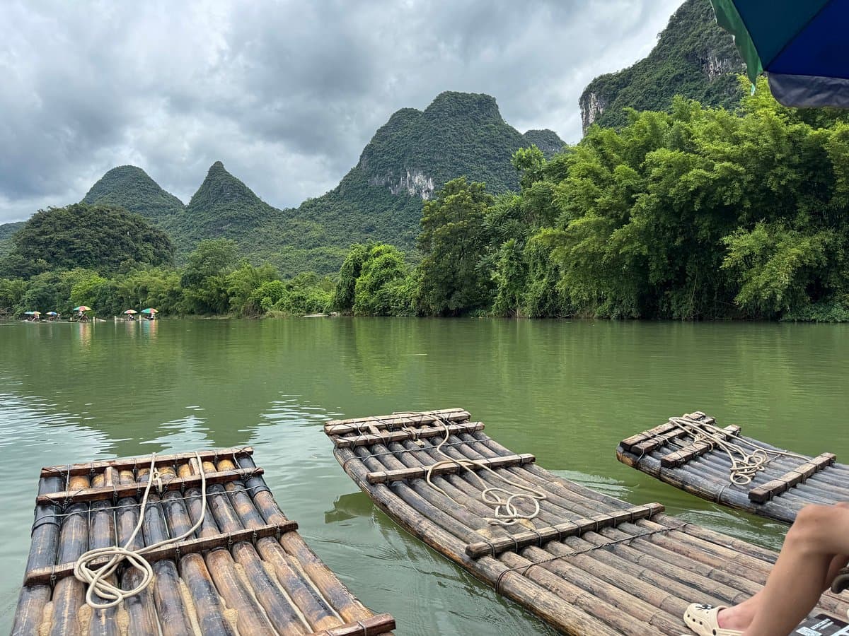 View from a bamboo raft drifting the Li River between karst peaks
