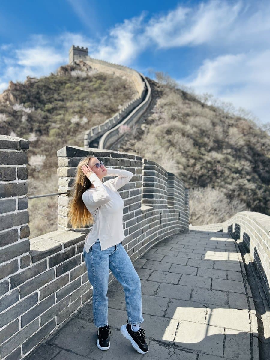 Sofia from Germany enjoying the spring blossoms on the Mutianyu Great Wall